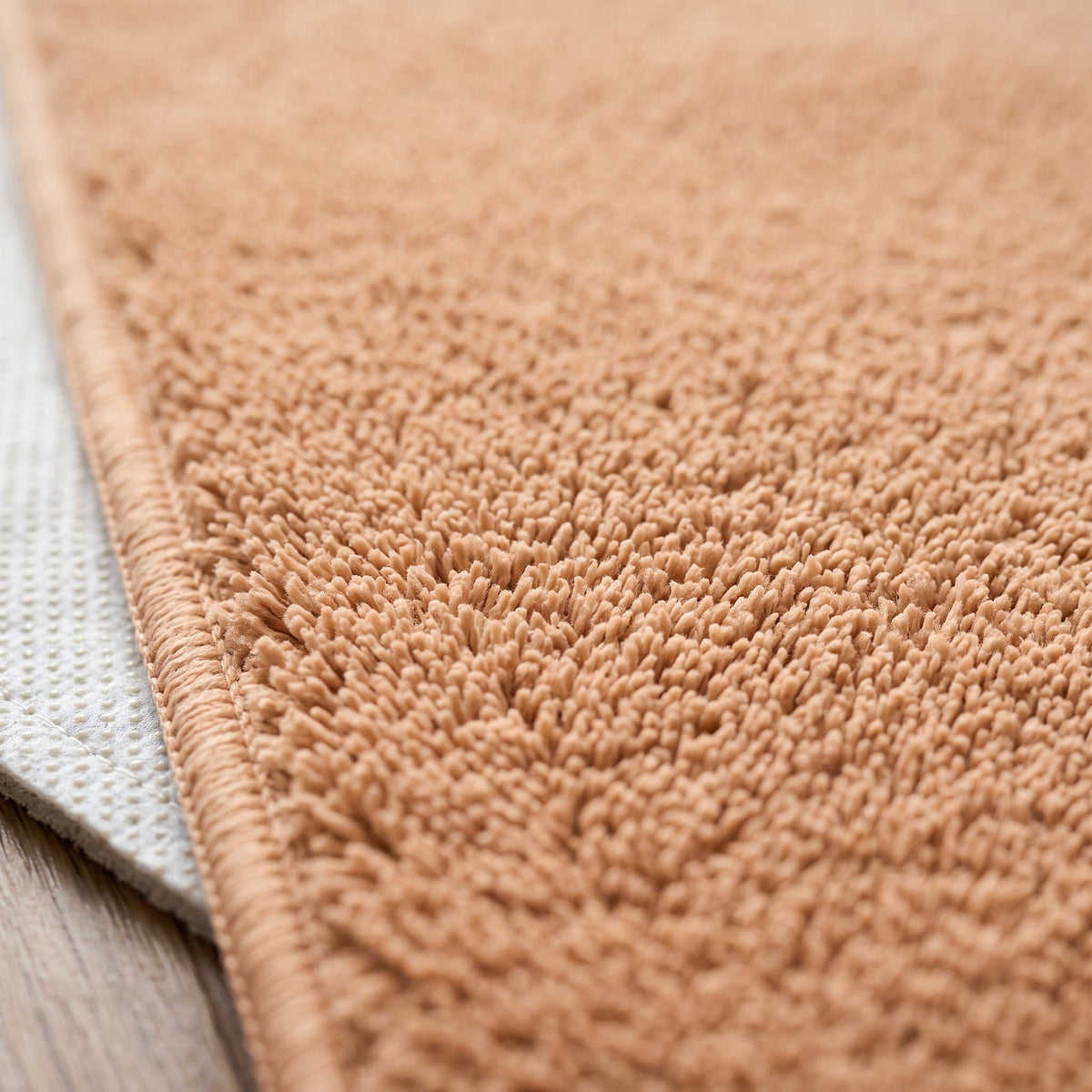 Gros plan sur la matière du Tapis de Bain Antidérapant Absorbant Abricot
