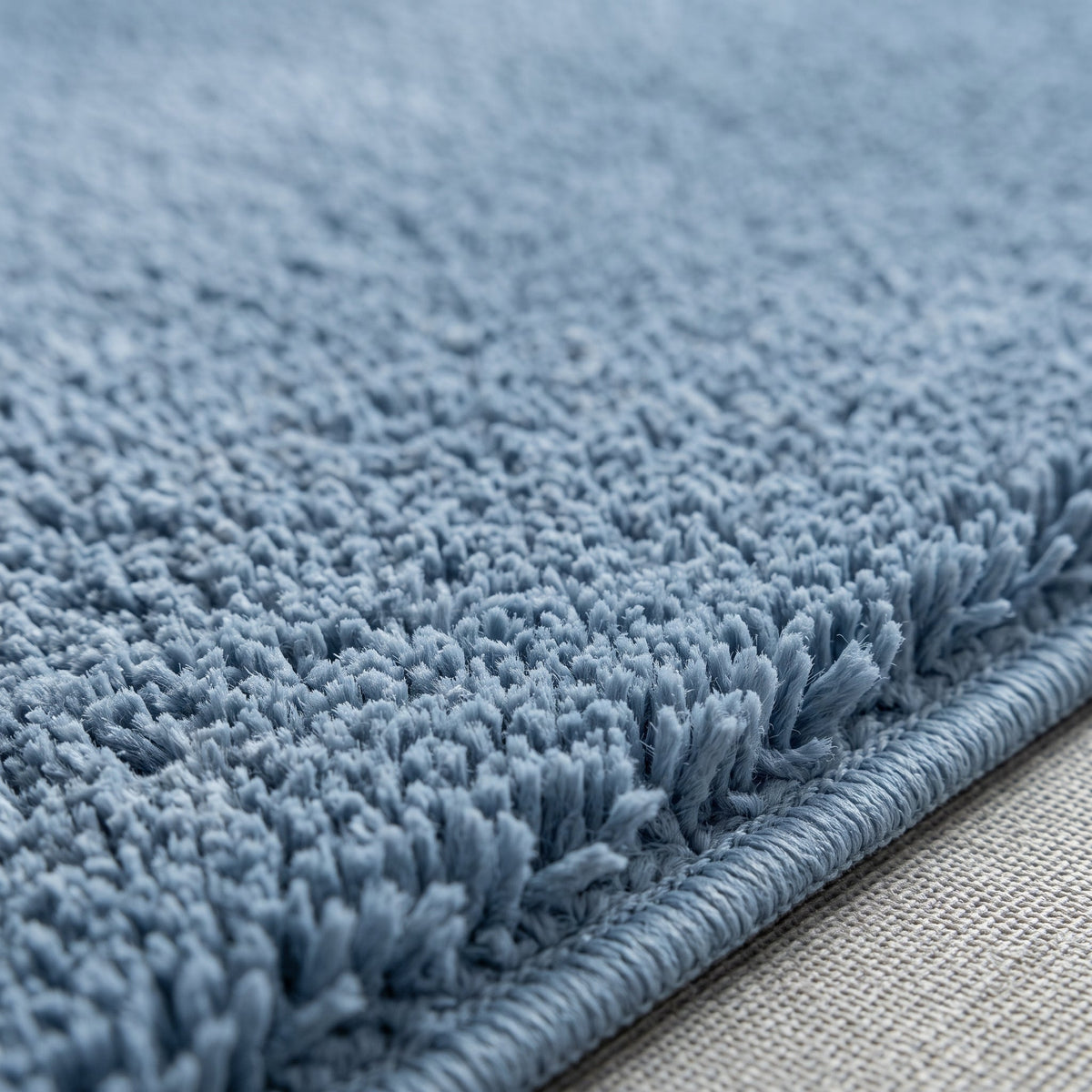 Gros plan sur la matière du Tapis de Bain Simple Antidérapant Bleu