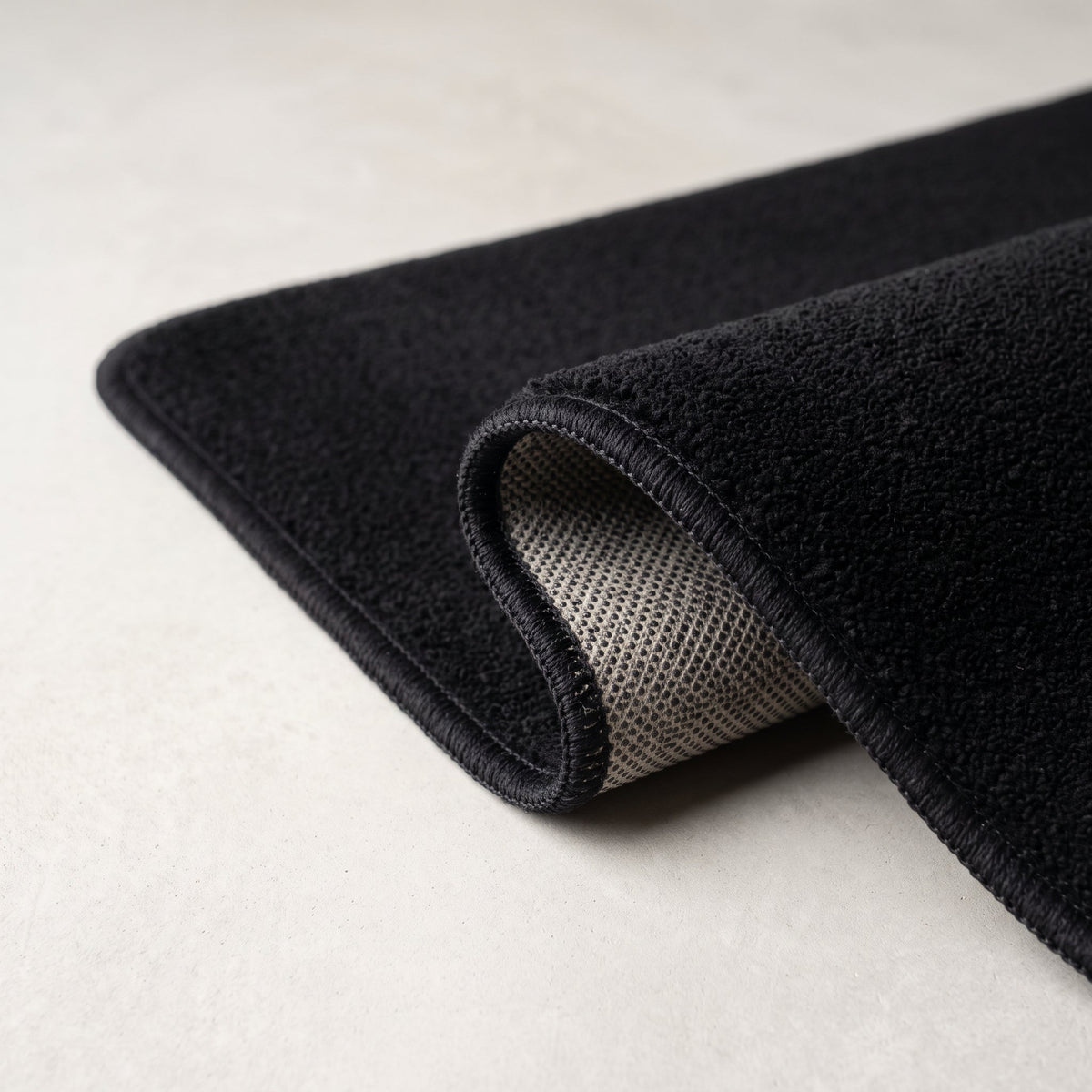 Détail du bord et de l'envers antidérapant, coloris noir
