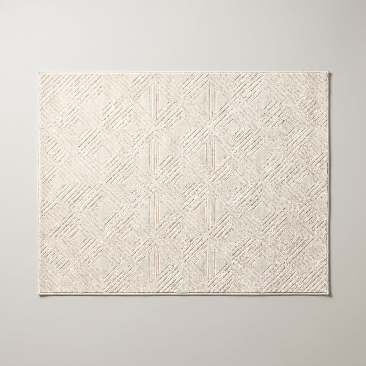 Tapis de salon géométrique crème vu du dessus, à plat